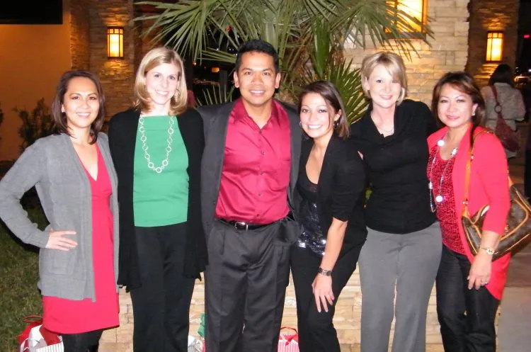 Photo of Dr. Aguila and team at Christmas party (standing)