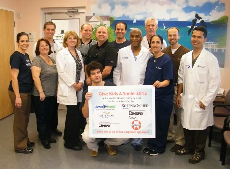 Photo of Richard E. Aguila, DDS and team at Give Kids a Smile event