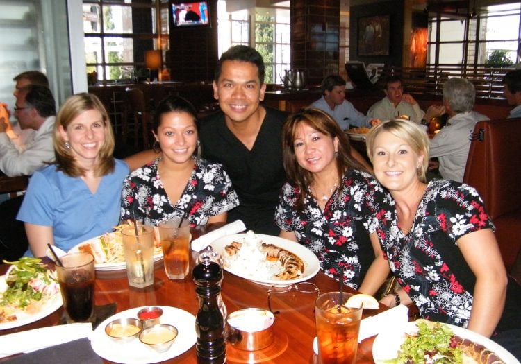 Photo of Dr. Aguila and staff at Laure’s & Arnie’s Birthday Luncheon