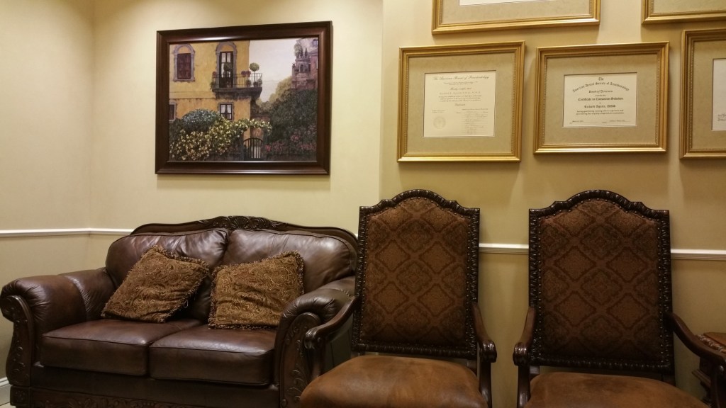 Interior Photo: Jacksonville FL periodontal office waiting room with rich furniture